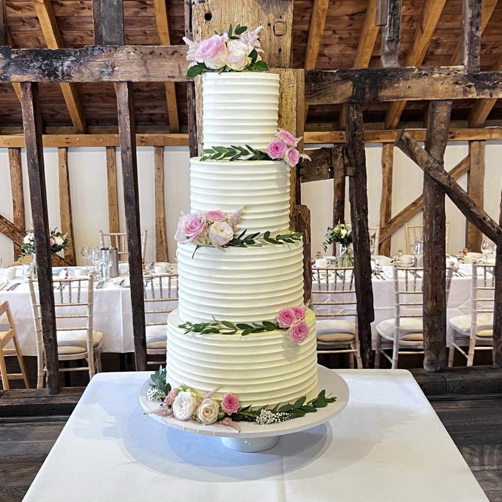 buttercream ridge wedding cake with fresh flowers